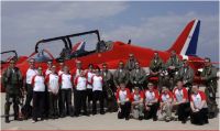 Cadets and staff pose with the red arrows after their display.  Photo: SAC A Scott, RAFAT - The Red Arrows